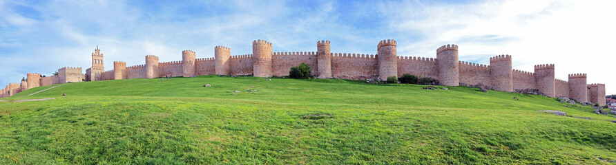 Fototapeta na wymiar Panoramic view on the battlements and walls surrounding the old town of Avila, Spain, the highest city on the Spanish meseta 