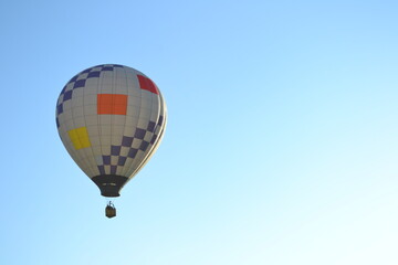 Geometric hot air balloon soaring in the early morning sky