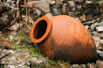 old Abandoned Kvevri on Ground. The Large Earthenware Vessel Used For The Fermentation, Storage And Ageing Of Traditional Georgian Wine.