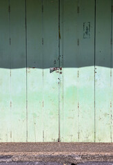 Classic light green wooden door for background.