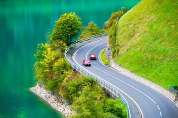 Lungern, canton of Obwalden, Switzerland. The road by the shore of the lake. A lake in a mountain valley. A popular place to travel.