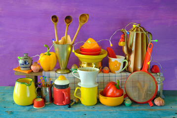 various vintage kitchen utensils from the seventies with vibrant colors, pop and trashy style kitchen still life