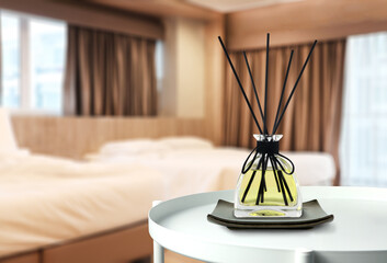 luxury aromatic scent of reed diffuser glass bottle is used as room freshener on the white metal...