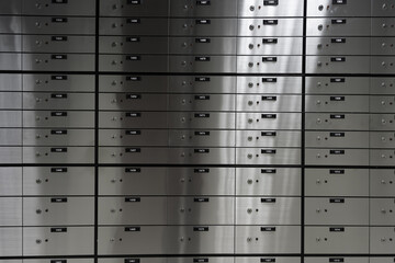 Safe deposit boxes of an a bank. Metal safe box panel wall.