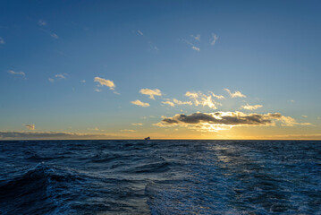 Beautiful seascape - waves and sky with clouds with beautiful lighting. Golden hour.