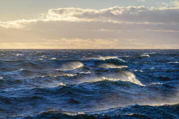 Beautiful seascape  waves and sky with clouds with beautiful lighting.  Golden hour.