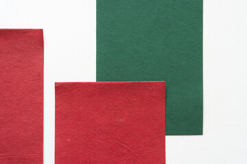 Fototapeta premium red and green paper on white paper background