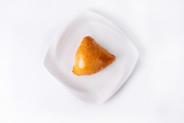 samsa in a white plate on a white background