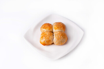 samosa made of dough with filling in a white plate on a white background