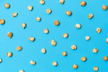 Fototapeta na wymiar Popcorn candy in pop art style on a blue background