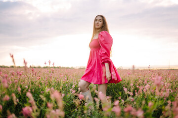 Happy  woman in the blooming field. Nature, vacation, relax and lifestyle. Summer landscape. Fashion, style concept.