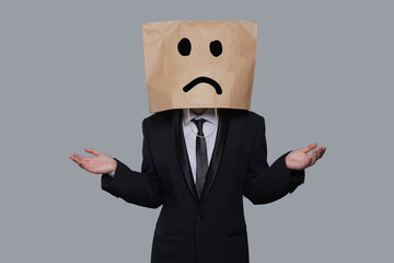 Businessman masked stress and doubt on gray banner background