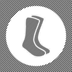 A large socks symbol in the center as a hatch of black lines on a white circle. Interlaced effect. Seamless pattern with striped black and white diagonal slanted lines