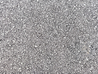 Asphalt background, sand and stones texture close view