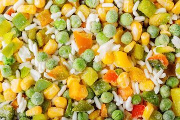 Food background with frozen vegetables with rice. Frozen vegetables retaining all nutrients: green...