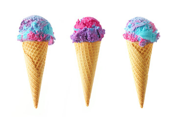 Three cotton candy flavored ice cream cones isolated on a white background. Pink, blue and purple...