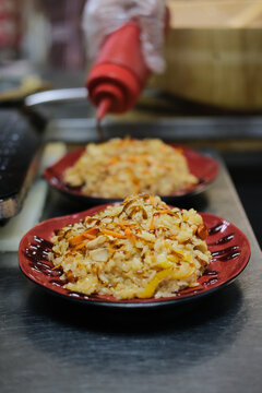 chahan in red plates on the restaurant's distribution table
