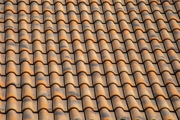 Old and weathered roof tiles creating a uniform and geometric texture typical of southeastern Spain