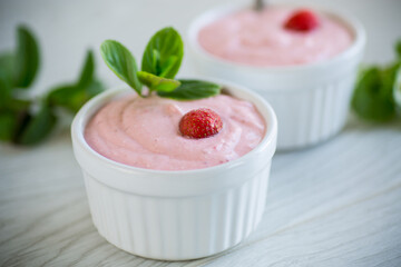 sweet curd mass whipped with fresh strawberries in a bowl