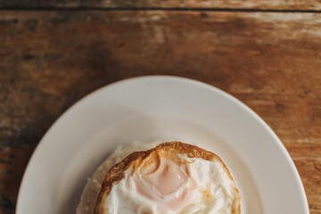 Simple food menu of Thai rice and fried egg on wooden table.