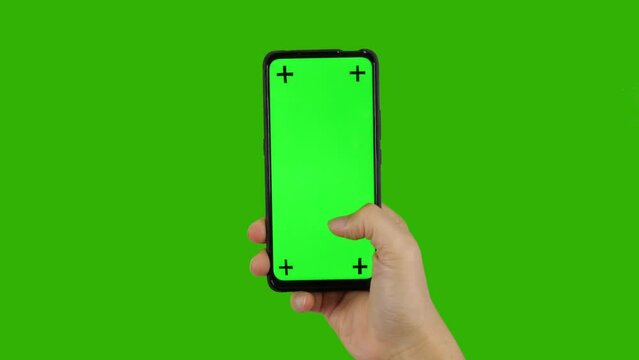Business man holding a phone with her finger touching the screen, smartphone green screen	