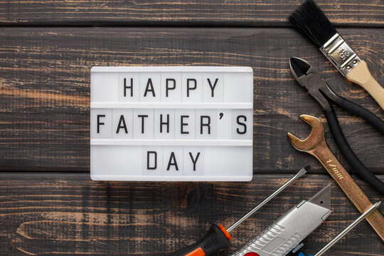 Work tools and equipment . Top view. Light box with text Happy Fathers Day