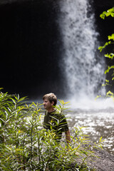 People are in the forest watching waterfalls and watching the beautiful nature playing in the water and relaxing on vacation. At Khao Yai National Park, Thailand, 16-05-2022