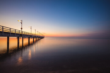 sunrise over the pier in Mechelinki. Baltic Sea 