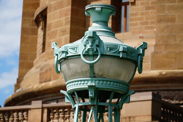 Old green street lamp at Friedrichsplatz in the city of Mannheim, Germany