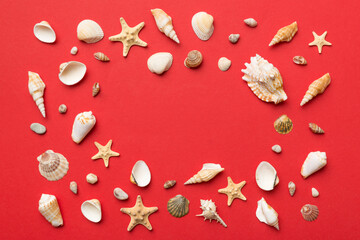 Summer time concept Flat lay composition with beautiful starfish and sea shells on colored table, top view with copy space for text