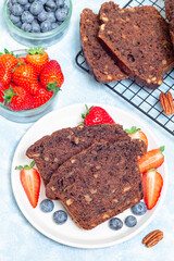 Chocolate zucchini or courgette bread with pecan nuts, vertical, top view
