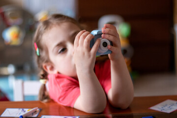 little child playing with a toy