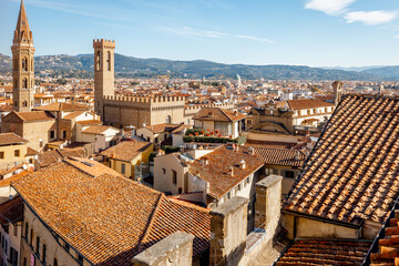Aerial view on the beautiful rooftops and old Abbey tower in Florence on sunnt day