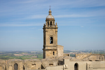 Obraz premium Typical Spanish brown village with bell tower and blue sky. Medina Sidonia, Cadiz, Andalusia, Spain, Europe.
