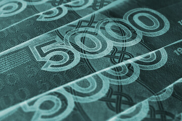 Russian banknotes 5000 rubles close-up. Fragment of a bill with a focus on the denomination figure. Dark turquoise inverted money background or wallpaper. Banking economy currency in Russia. Macro