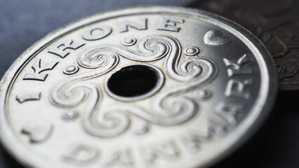 1 Danish krone coin close-up. National currency of Denmark. Money illustration for news about economy or finance. Bank and loan. Savings and interest. Macro