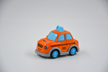 small orange taxi toy 