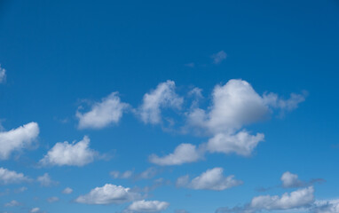 blue sky and white puffy clouds 
