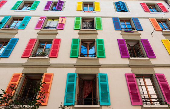 Geneva, Switzerland - June 3, 2022: Window shutters of a building in Geneva in rainbow colors as a support to LGBTQ people and organisations.