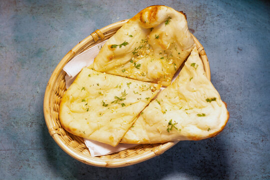 Special Garlic naan sliced served in a dish top view of pakistani and indian food