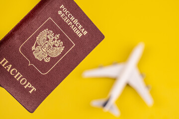 Airplane on the russian passport. Travel concept. Yellow background. - 508852196