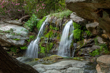 Fototapeta na wymiar Andros waterfall long-exposure smooth water flow nature wallpaper