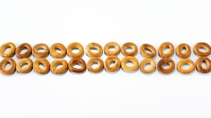 Many small bagels isolated on white background.