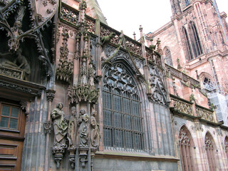 The main cathedral of Strasbourg France. Romanesque and gothic architecture style. Most famous Catholic cathedrals.  design details, stone carving, statues, columns. April 2009.