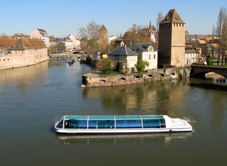 View of the fortress of Strasbourg and the river Ile, reflection in the water, spring, blossoming...