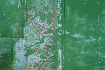 Painted green surface of old peeling paint background. High quality photo