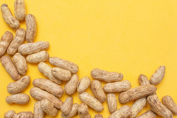 several boiled peanuts on a yellow background