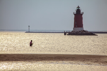 Fishing by Cape Henlopen Lighthouse © francis