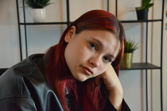 Young Girl In Black Jacket Dark Red Hair Wait In Office