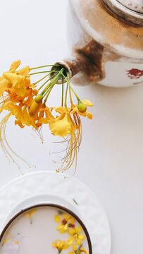 A Teapot, Afternoon Brunch, Tea Time, FLowers in a Tea pot, Cup Of milk with FLower, Coneptual Art